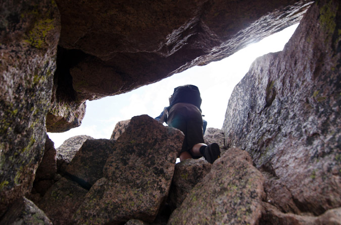 Climbing the chimney in Sunlight Spire