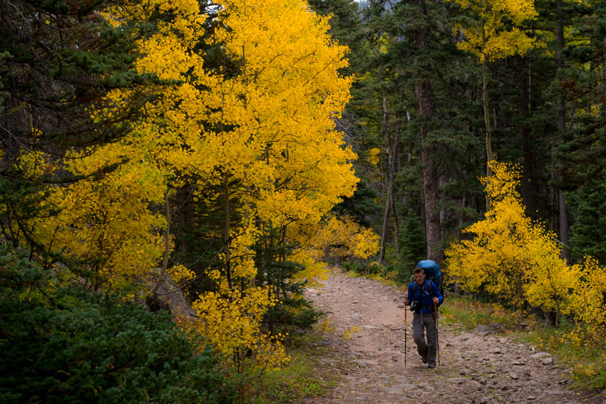 Sarah hikes with autumn color up the South Colony Lakes Trail